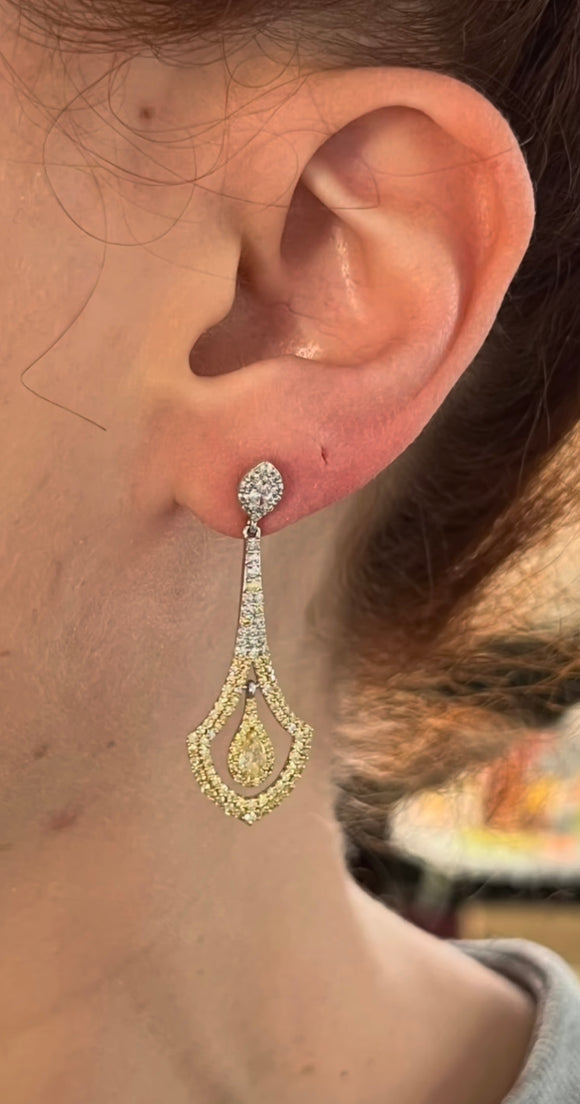 White gold diamond earrings with pear shaped yellow diamonds, marquise white diamonds, and round yellow and white diamonds natural