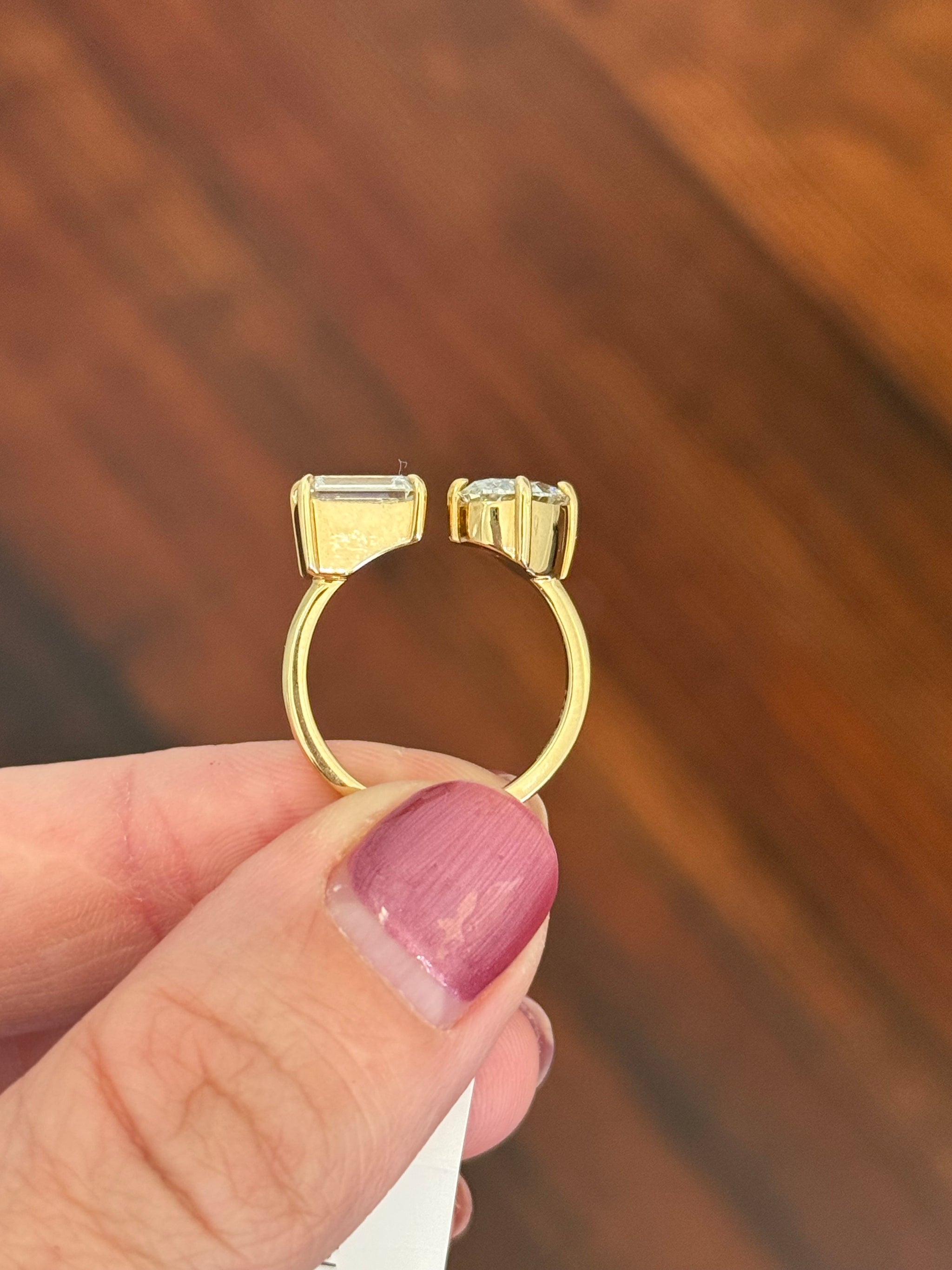 Yellow gold emerald cut and oval lab diamond toi et moi ring