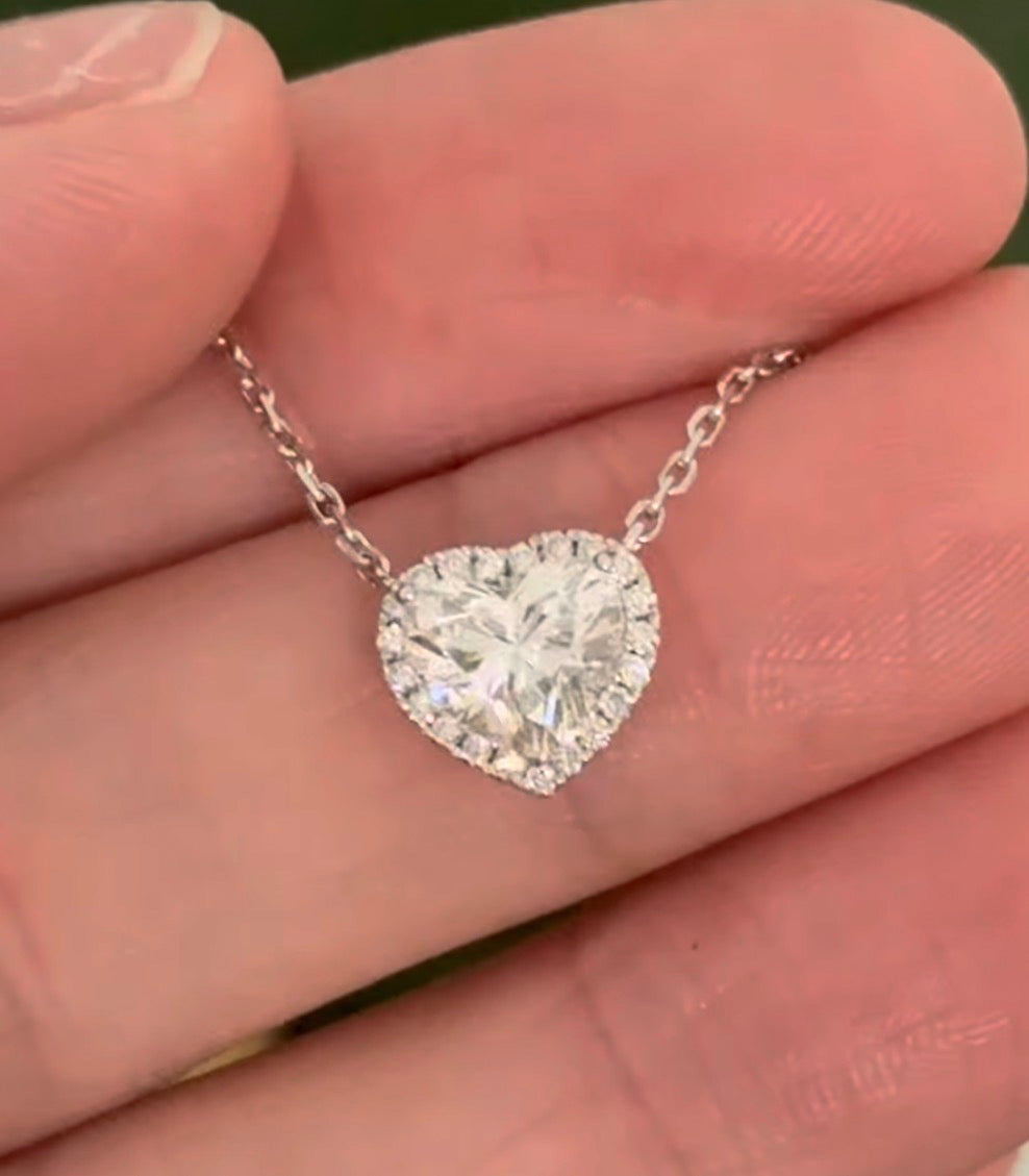 White gold heart shaped lab diamond necklace. Center stone is 1.05cts and measures 6x6.9mm. Chain is 16” with an adjustment of 4” to make as long as 20”.