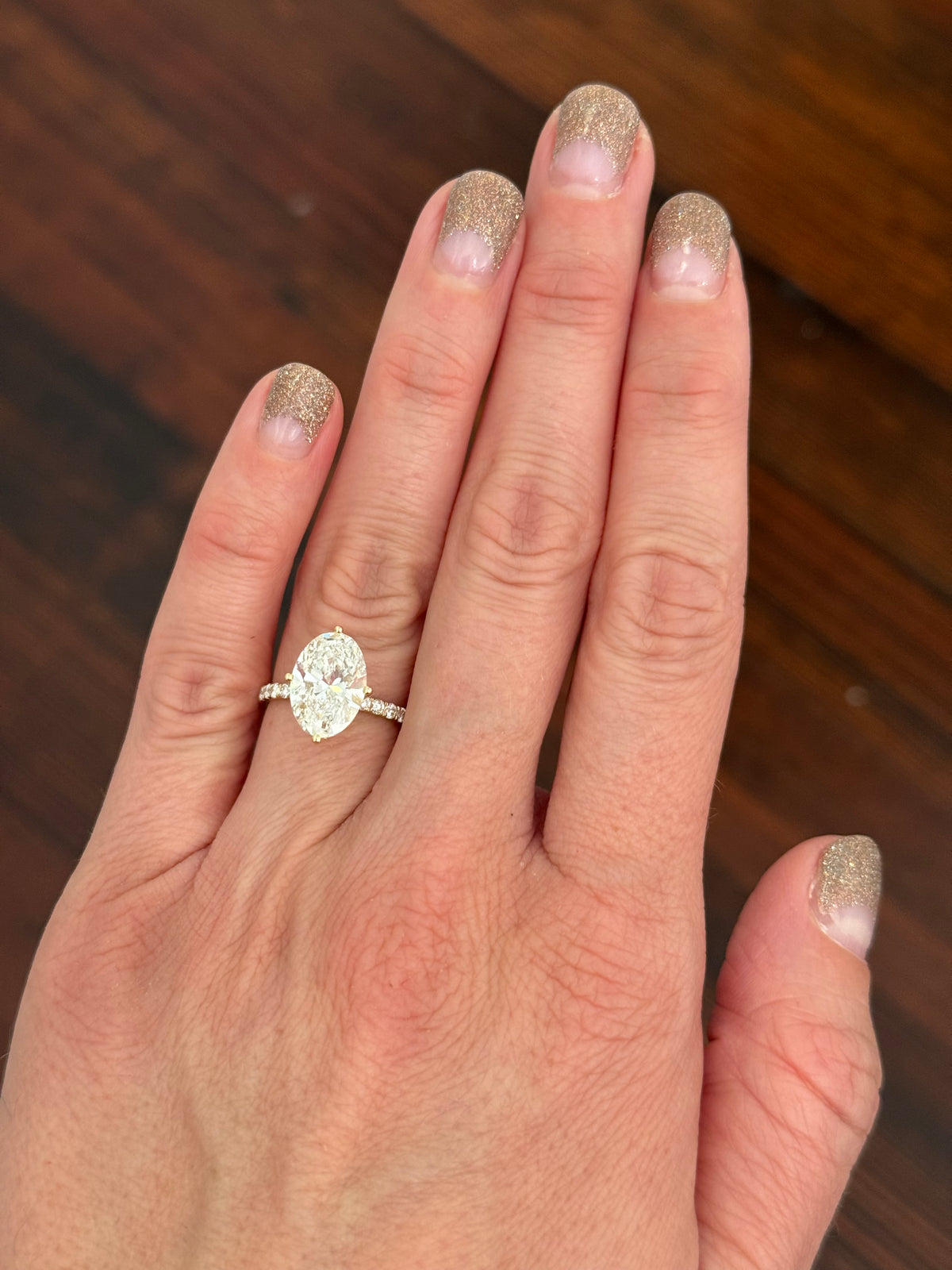 IGI certified yellow gold oval and round lab diamond ring. Center stone is 3.82cts