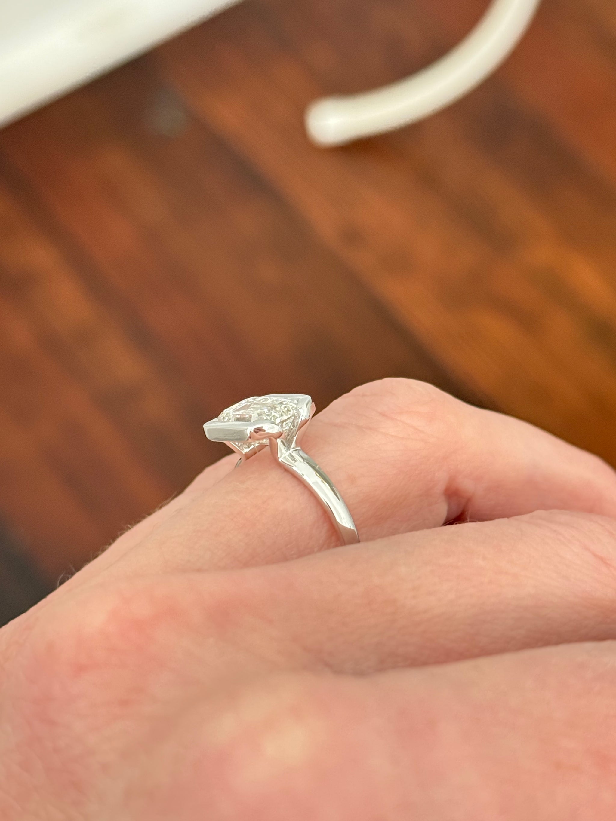 White gold east west set IGI certified 3ct emerald cut lab diamond ring