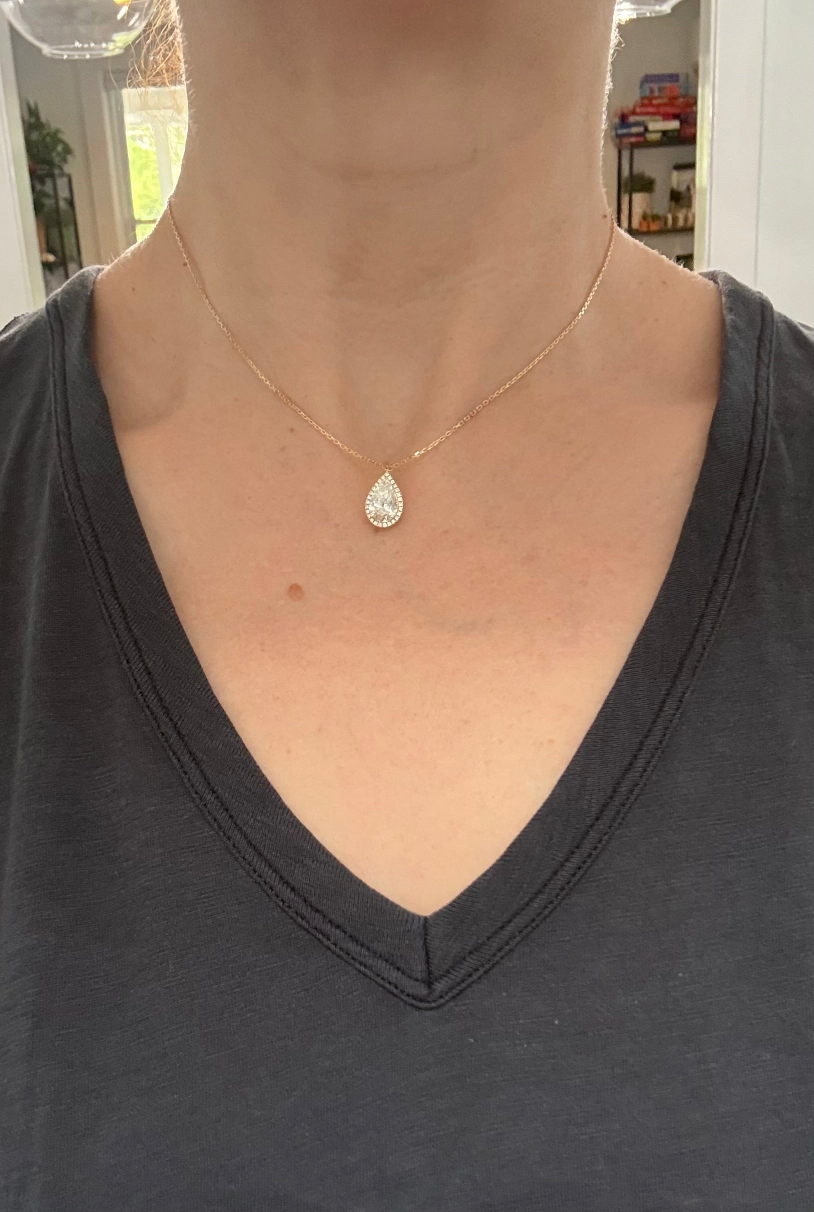 Yellow gold pear shaped lab diamond necklace. Center stone 2.07cts and measures 11x6.6mm. Chain is 16” with an adjustment of 4” to make as long as 20”.