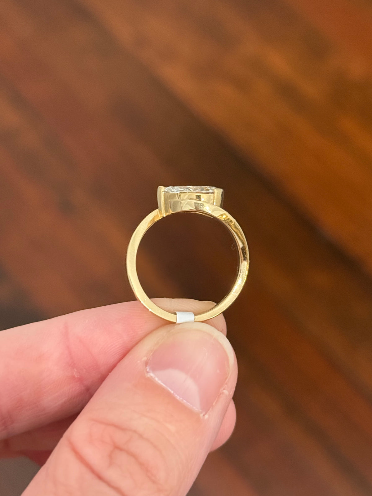 Yellow gold pear shape and round lab diamond ring. Pear shape is IGI certified and 1.54cts E VS1