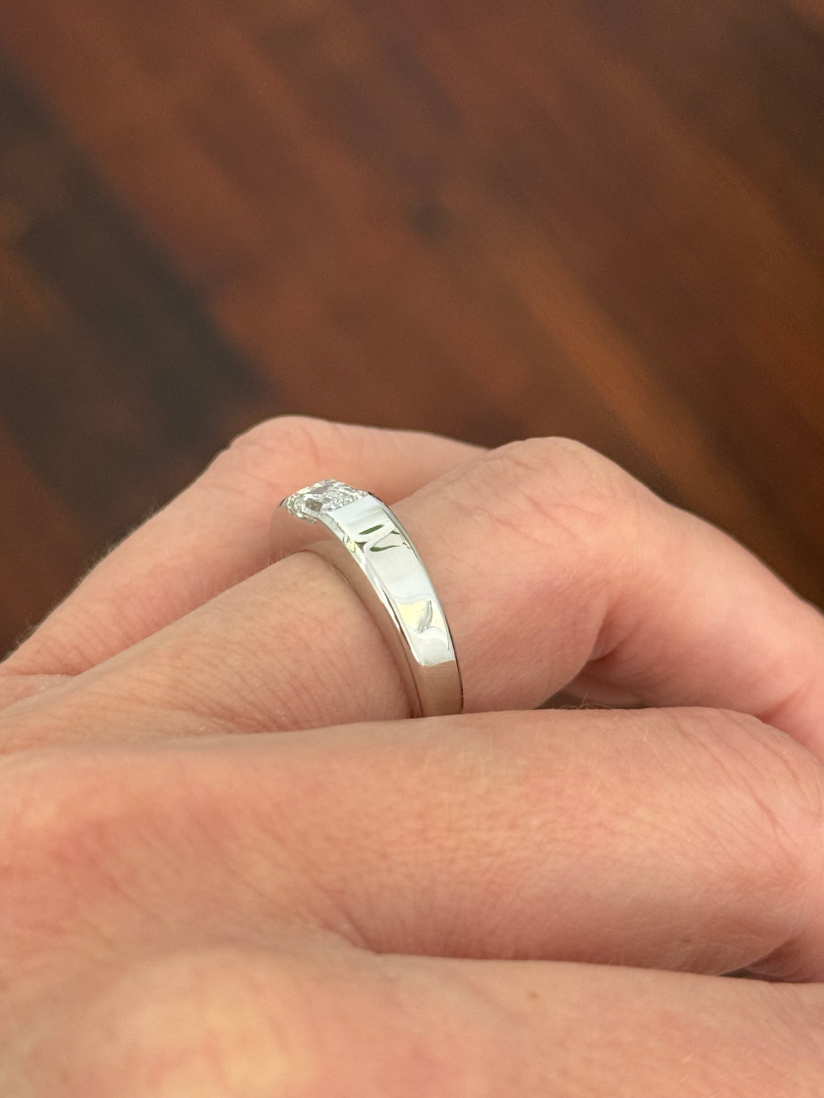 White gold 1.2ct emerald cut lab diamond band. Emerald cut measures approximately 6.5x4mm