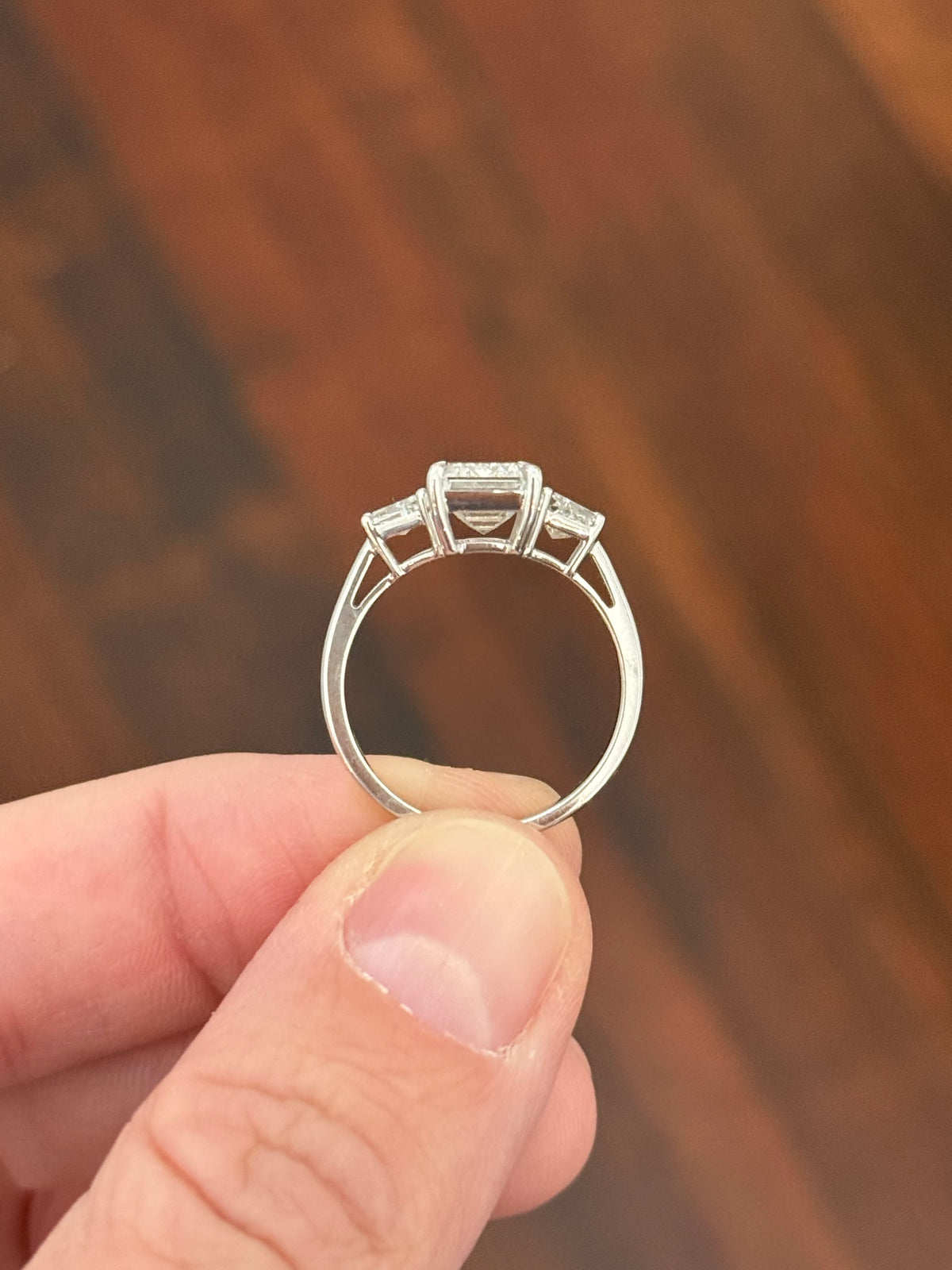White gold IGI certified 3.04ct emerald cut lab diamond and trapezoid lab diamond ring. Emerald cut measures 10.12x6.70x4.46mm