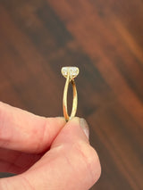IGI certified yellow gold cushion and round lab diamond ring. Center stone is 1.57cts