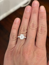 White gold IGI certified emerald cut and tapered baguette lab diamond ring. Center stone is 3.06cts