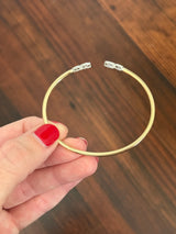 Yellow gold oval lab diamond bracelet. Lab diamond are bezel set in white gold