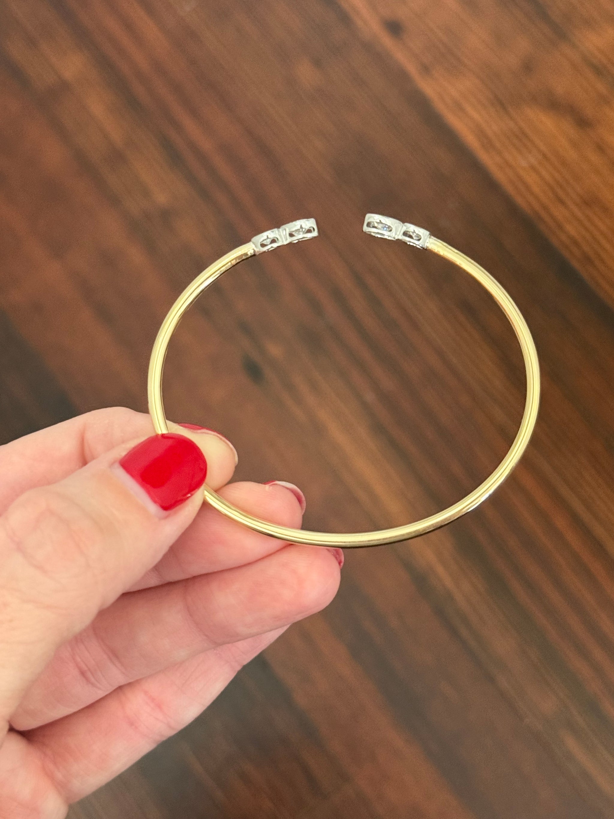 Yellow gold oval lab diamond bracelet. Lab diamond are bezel set in white gold