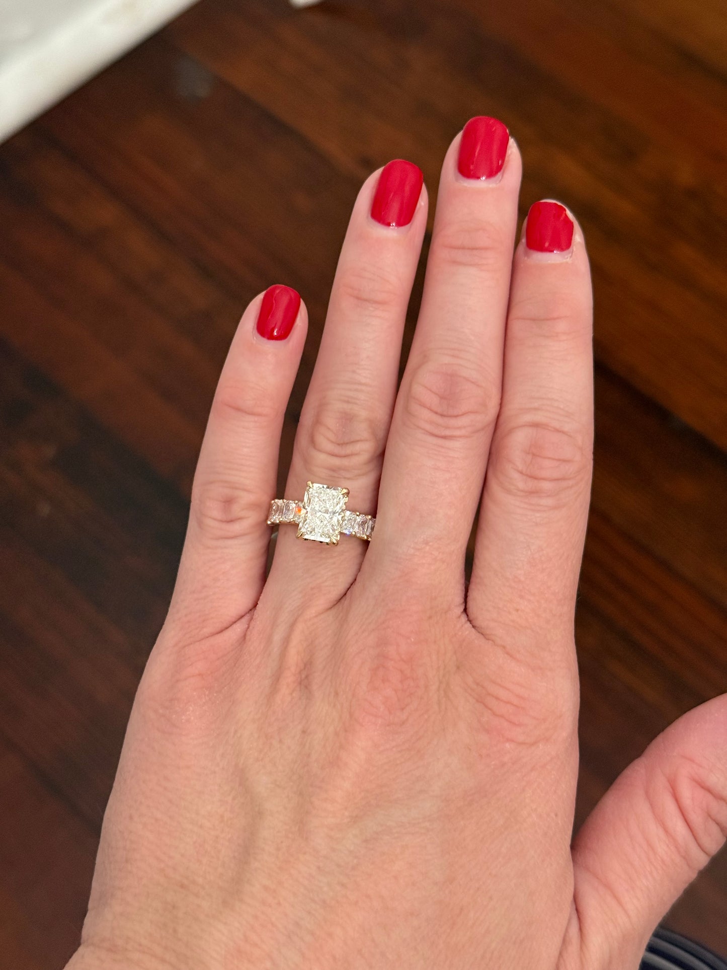 Yellow gold radiant lab diamond ring. Center stone is IGI certified and 3.01cts E VVS2