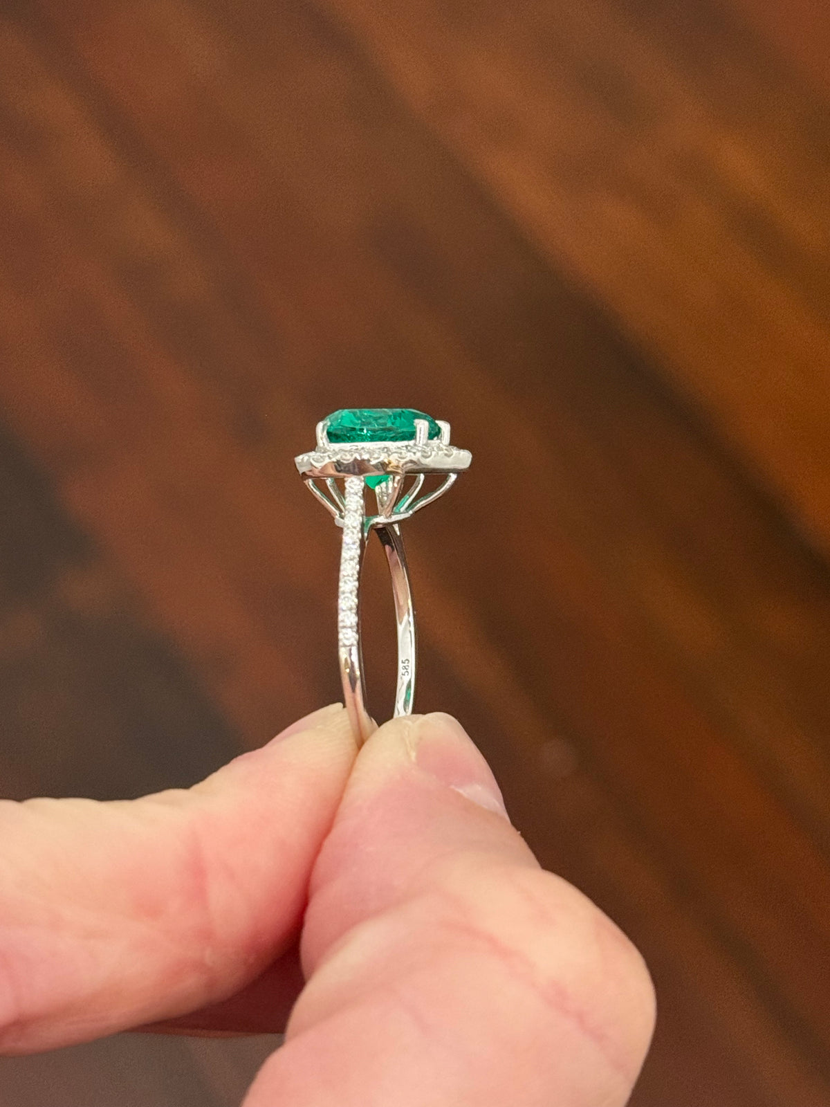 White gold heart shaped lab emerald and round lab diamond ring. Center stone is 2.32cts