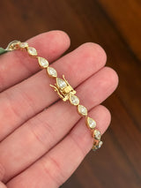 Yellow gold bezel set 6.4ct marquise and pear shape natural diamond bracelet