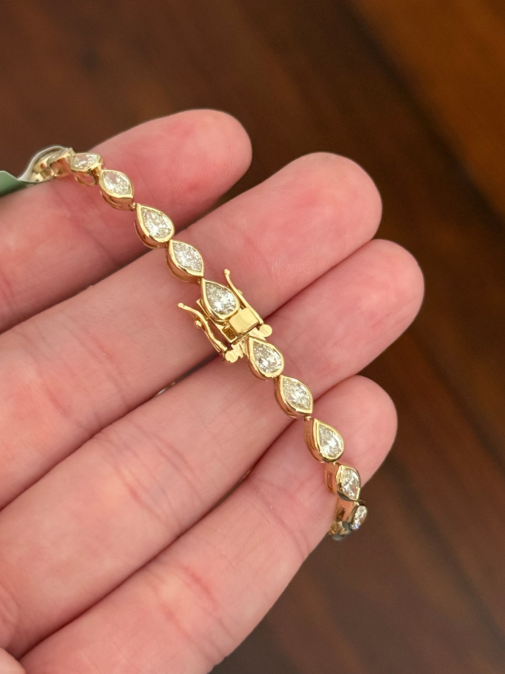 Yellow gold bezel set 6.4ct marquise and pear shape natural diamond bracelet