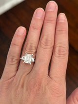 White gold emerald cut, trapezoid, and round lab diamond ring. Center stone is 4.06cts