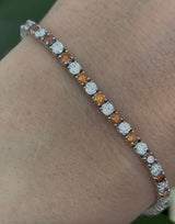 4 prong white gold 4.99ct orange and white lab diamond tennis bracelet