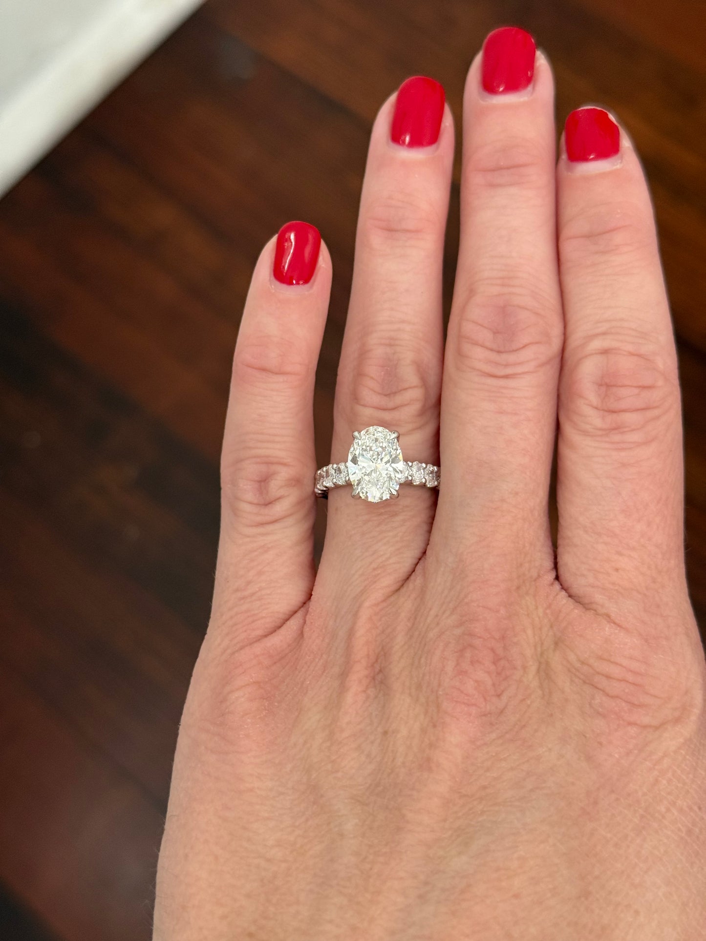 White gold oval lab diamond ring. Center stone is IGI certified and 3.07cts E VVS2