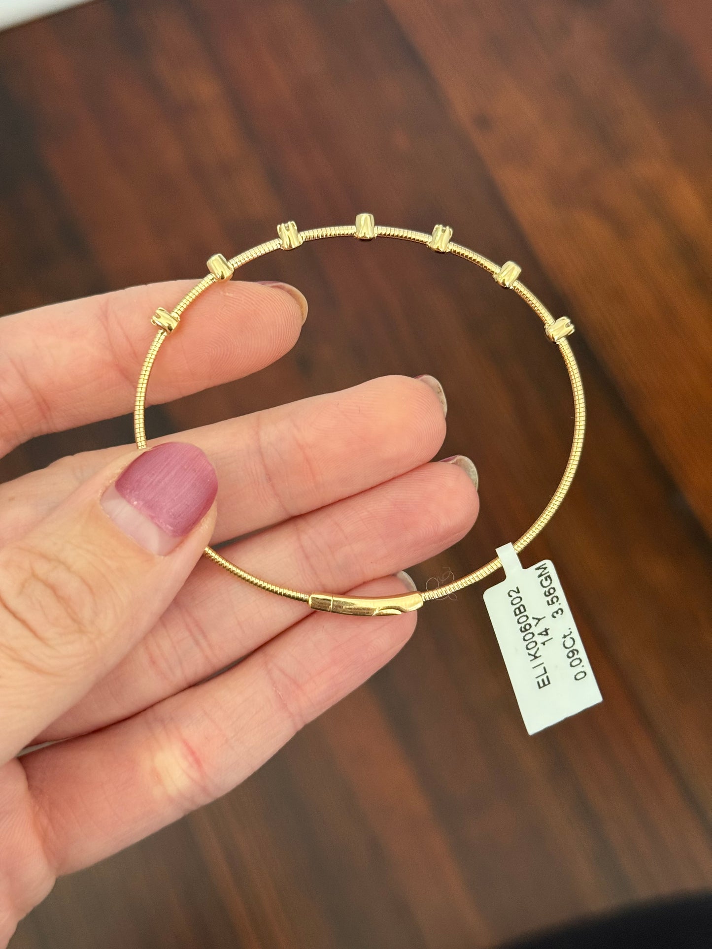 Natural diamond flex bracelets available in yellow gold with sapphires, yellow gold with rubies, and white gold with emeralds
