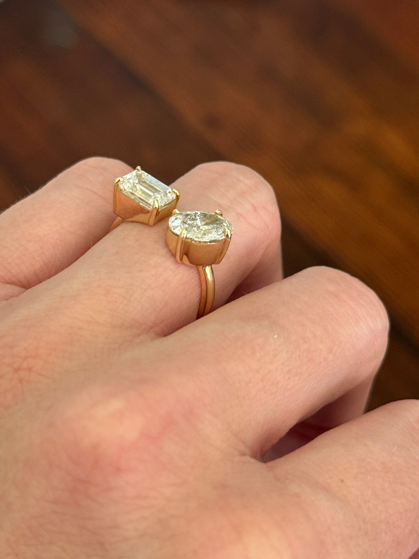 Yellow gold emerald cut and oval lab diamond toi et moi ring