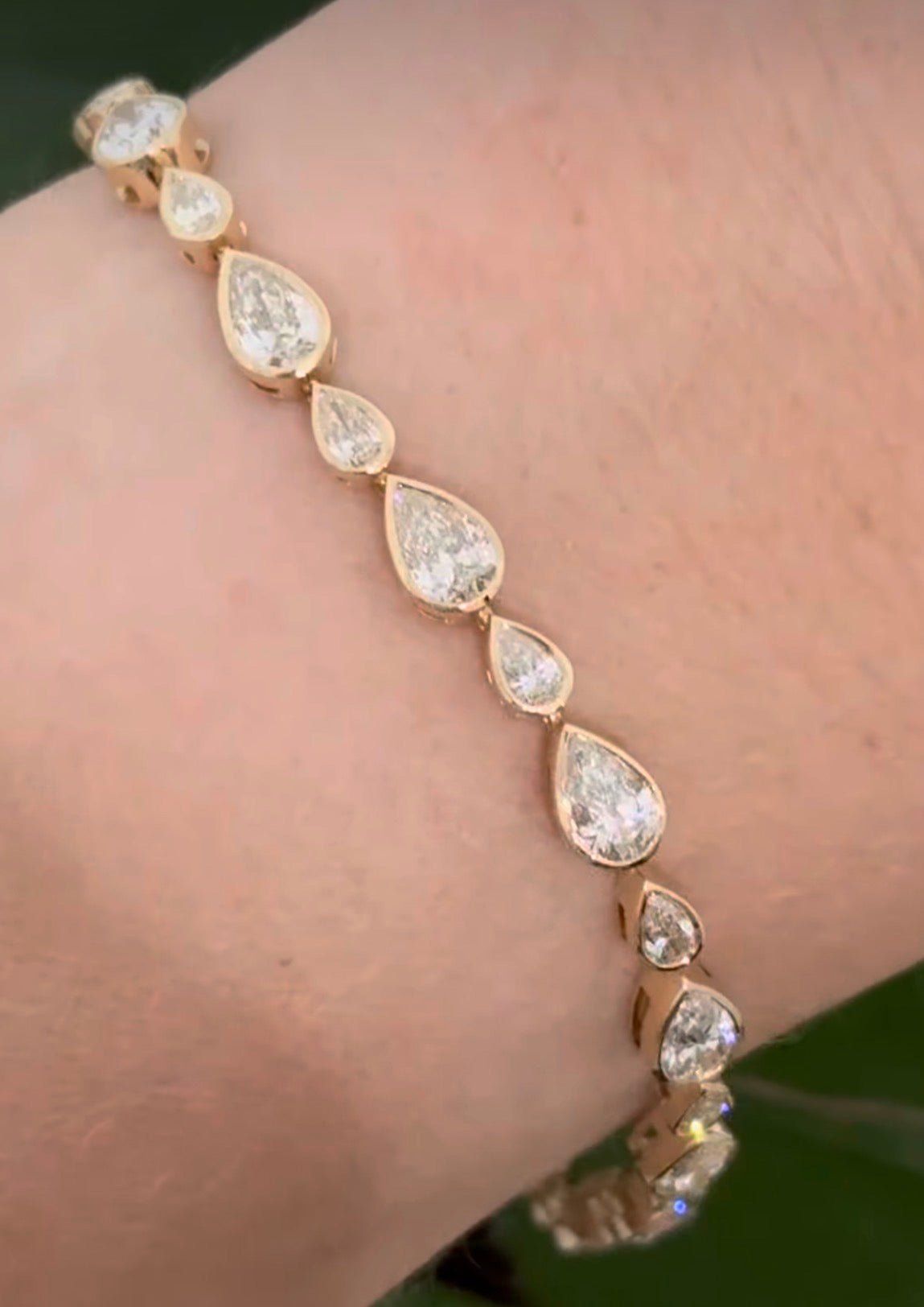 Yellow gold bezel set 6.64ct pear shaped natural diamond bracelet
