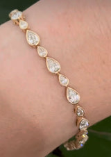 Yellow gold bezel set 6.64ct pear shaped natural diamond bracelet