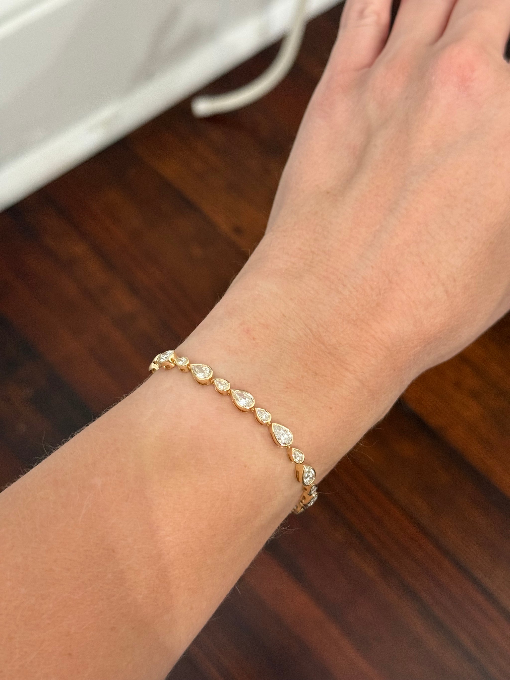 Yellow gold bezel set 6.64ct pear shaped natural diamond bracelet
