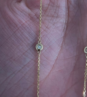 Yellow gold round lab diamond necklace with 4 bezel set lab diamond on either side of chain