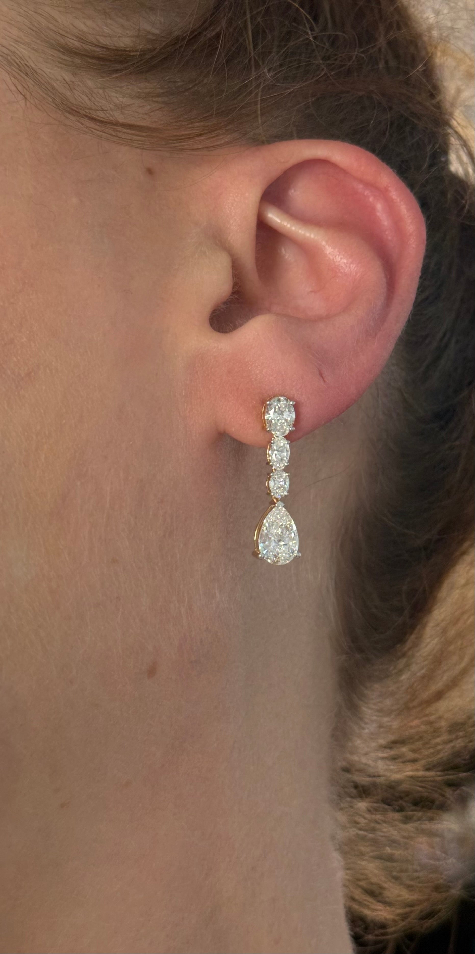 Yellow gold pear shape and oval lab diamond earrings. Prongs are white gold.