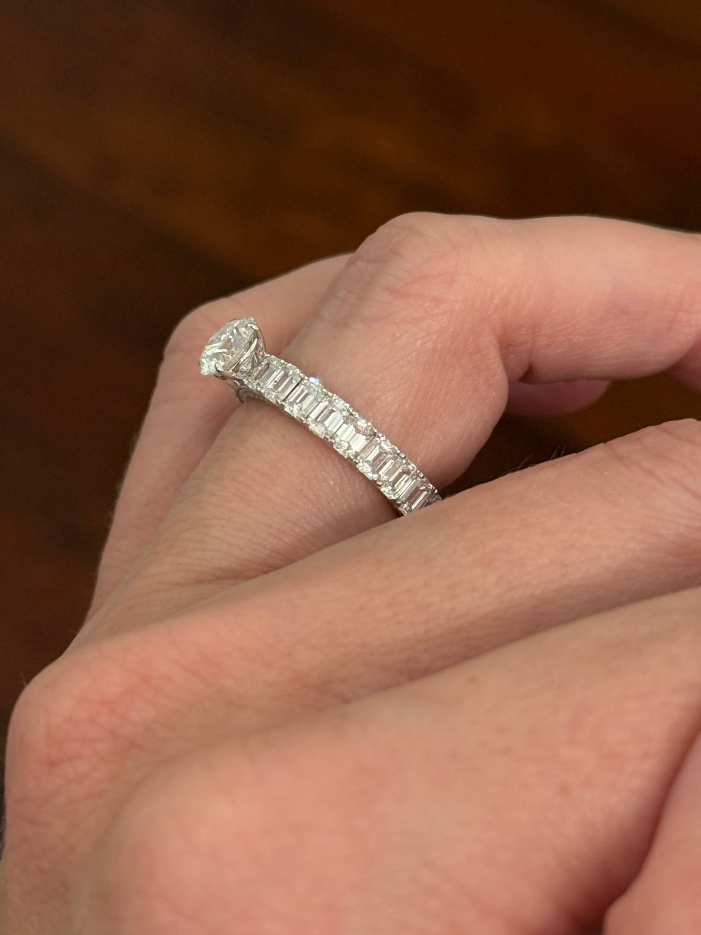 White gold 1.09ct round lab diamond and 4.1ct emerald cut eternity ring