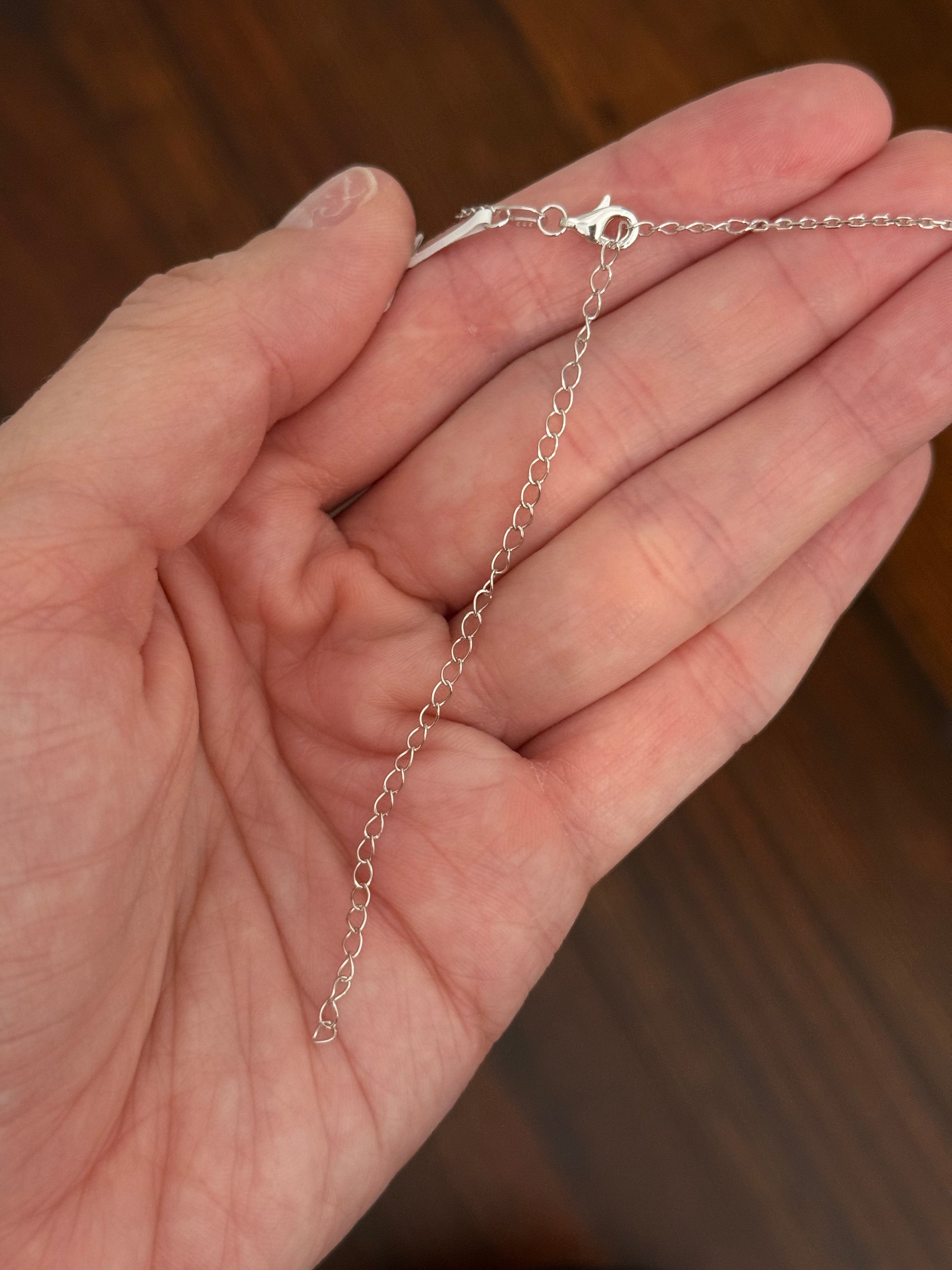 White gold heart shape lab diamond necklace. Center stone is 5.08cts and measures 10.x11.3mm. Chain is 16” with 4” of adjustment to make as long as 20”.