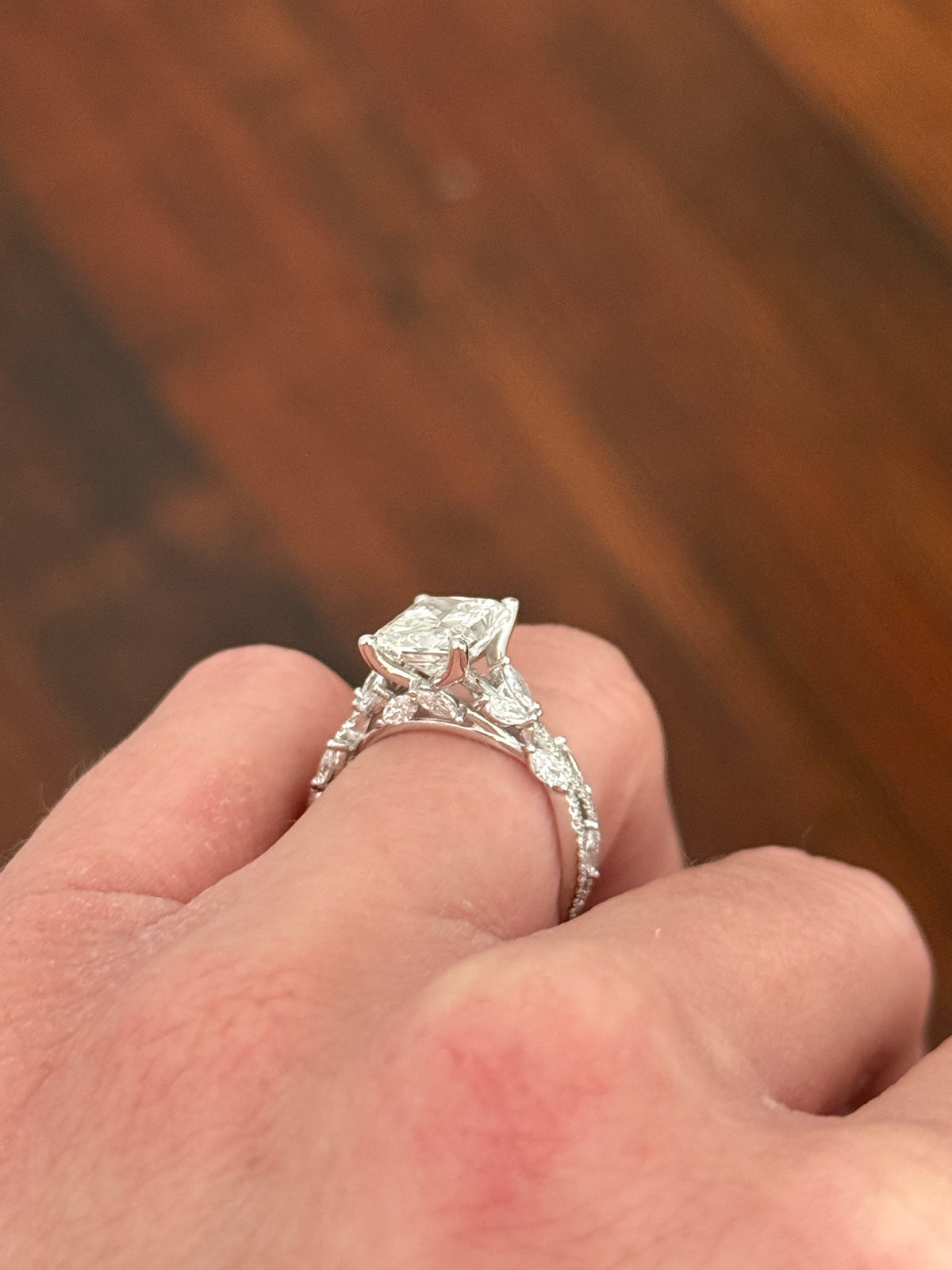 White gold radiant, marquise and round lab diamond ring. Center stone is 3.06cts E VS1 and measures 9.7x6.6mm