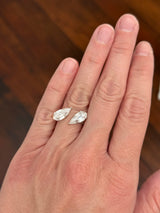 White gold 4.38ct step cut pear lab diamond bypass ring. Each measures 12.78x6.10mm