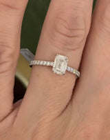 White gold 1.35ct emerald cut lab diamond ring. Center stone is 1.09cts and measures 6.7x4.3mm