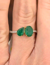 White gold natural emerald and diamond ring. Emeralds prongs are yellow gold.