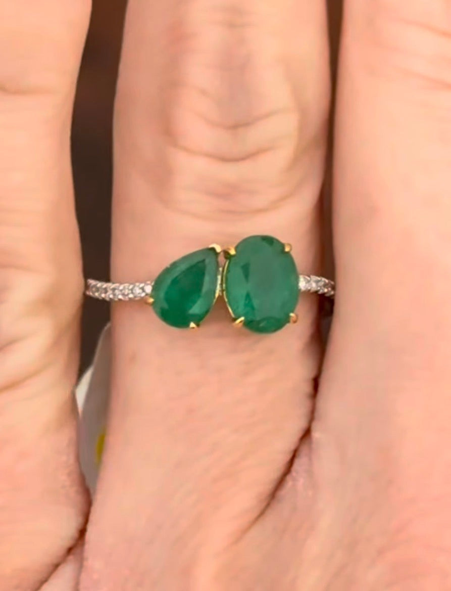 White gold natural emerald and diamond ring. Emeralds prongs are yellow gold.