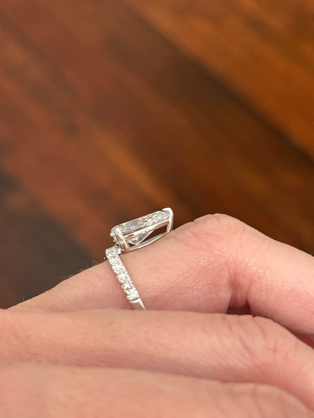 White gold pear shape and round lab diamond ring. Center stone is 3.08cts