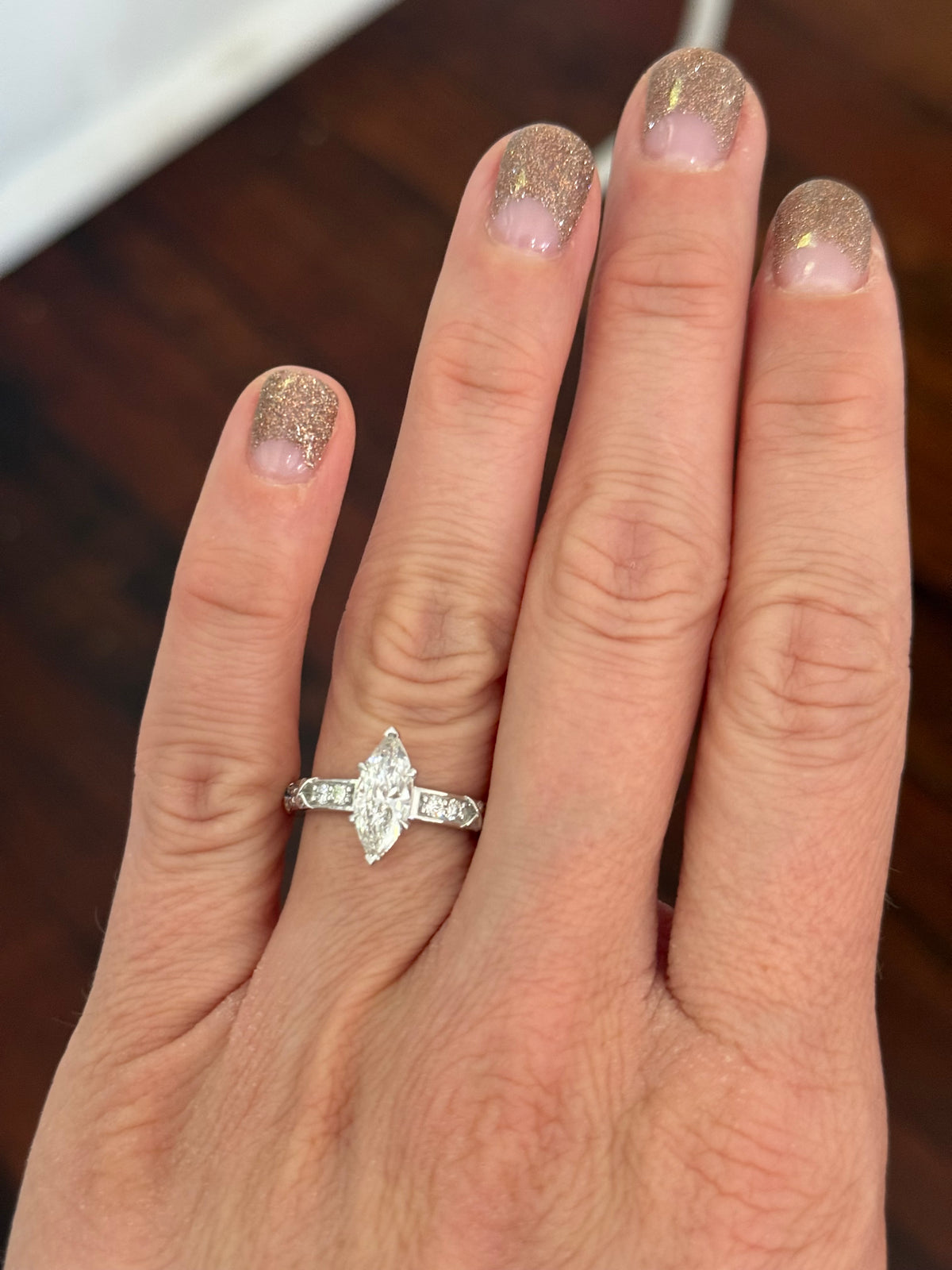 White gold marquise and round lab diamond ring. Center stone is 1ct and approximately 12x4.6mm
