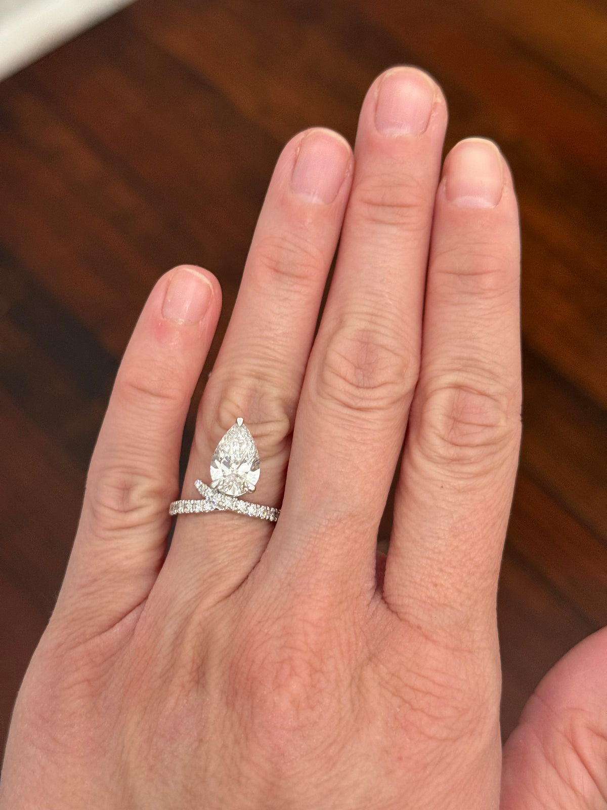White gold pear shape and round lab diamond ring. Center stone is 3.08cts