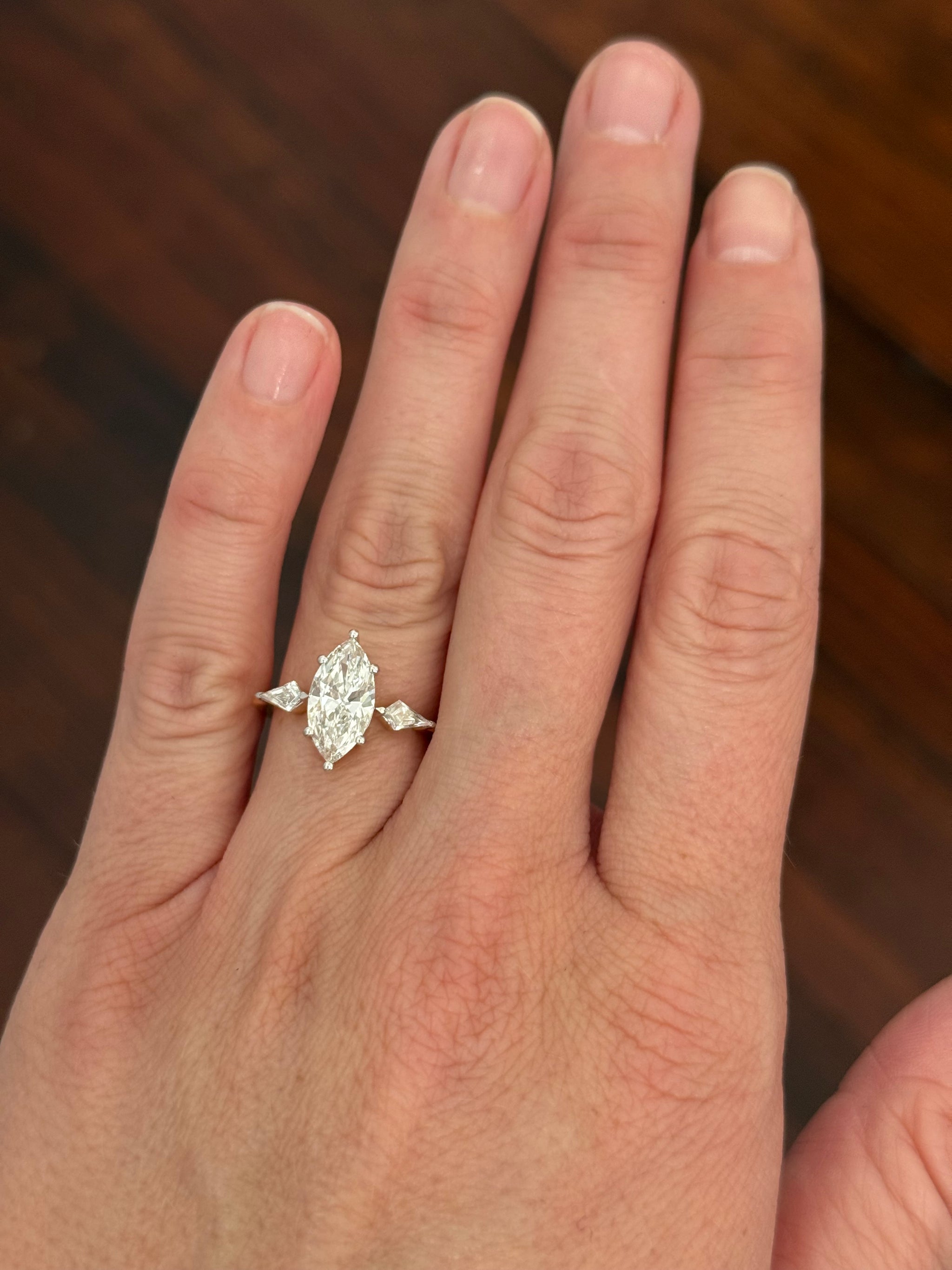 Yellow gold marquise and kite lab diamond ring. Prongs are white gold.