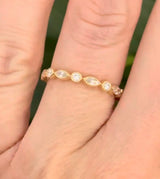 Yellow gold bezel set marquise and round lab diamond band