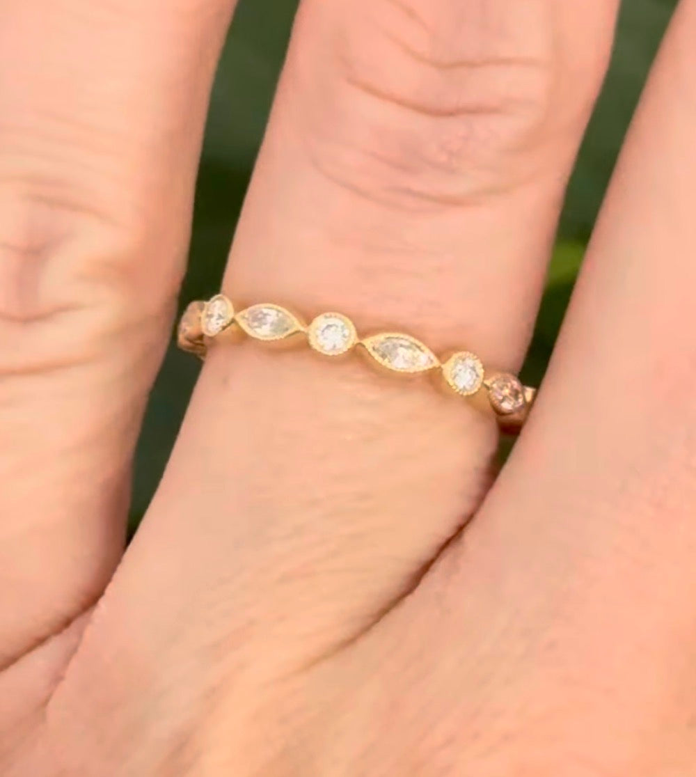 Yellow gold bezel set marquise and round lab diamond band