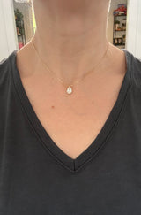 Yellow gold pear shaped lab diamond necklace. Center stone is 1.05cts and measures 8.6x5.4mm. Chain is 16” with an adjustment of 4” to make as long as 20”.