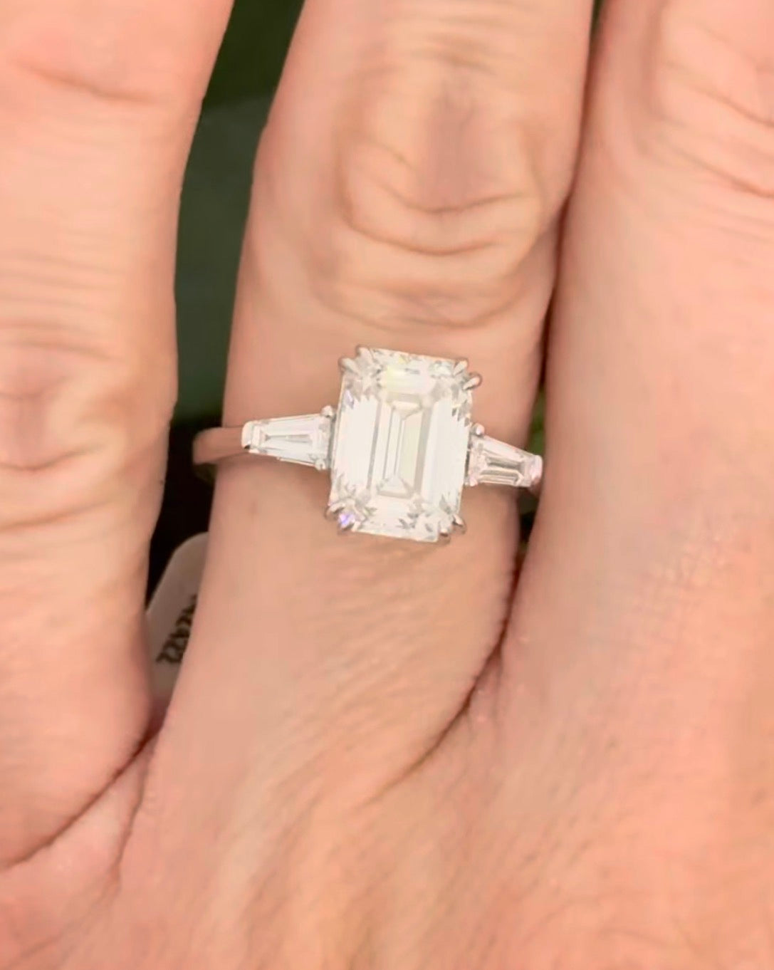 White gold IGI certified emerald cut and tapered baguette lab diamond ring. Center stone is 3.06cts