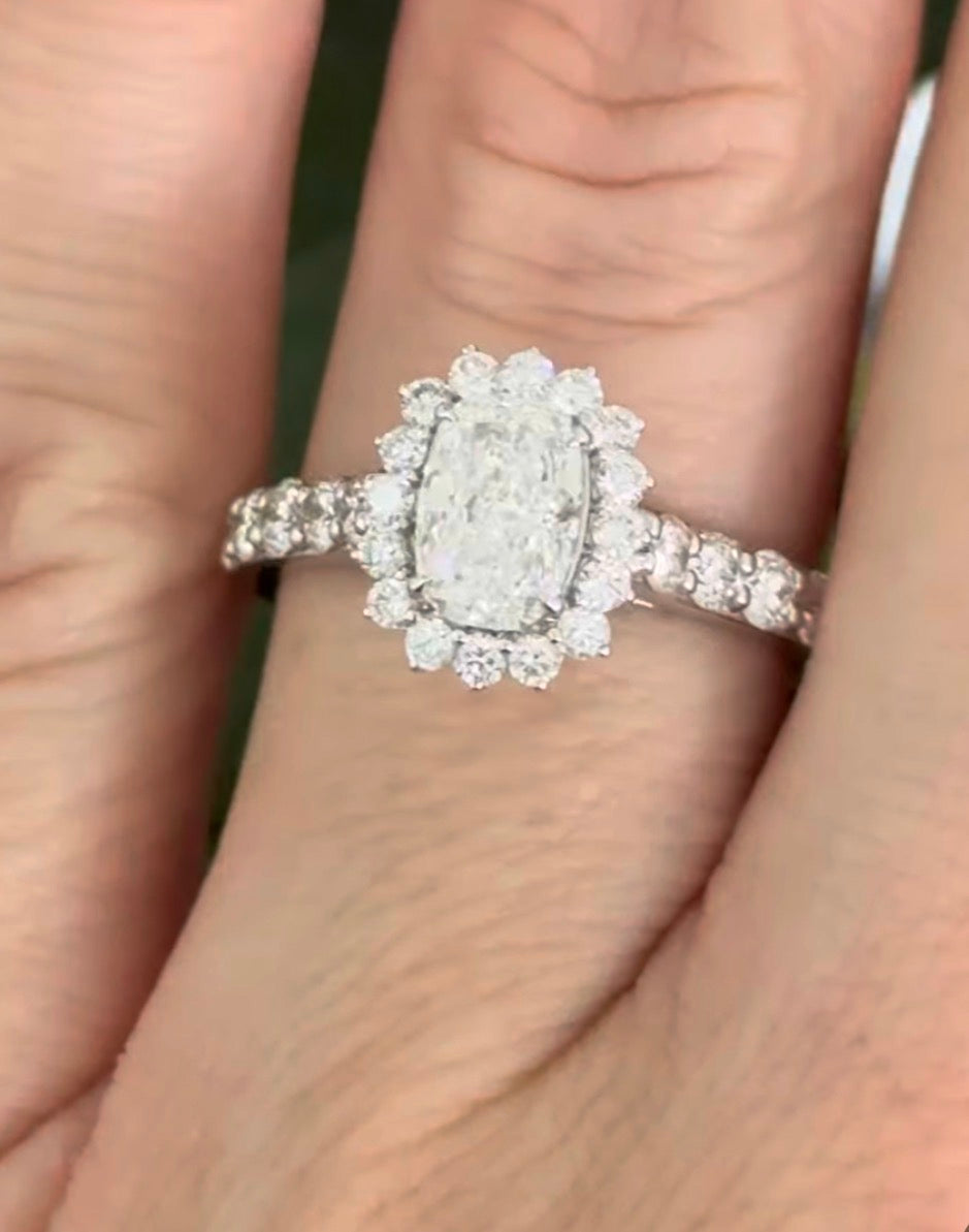 White gold cushion and round lab diamond ring. Center stone is 1ct and 7.1x4.8mm