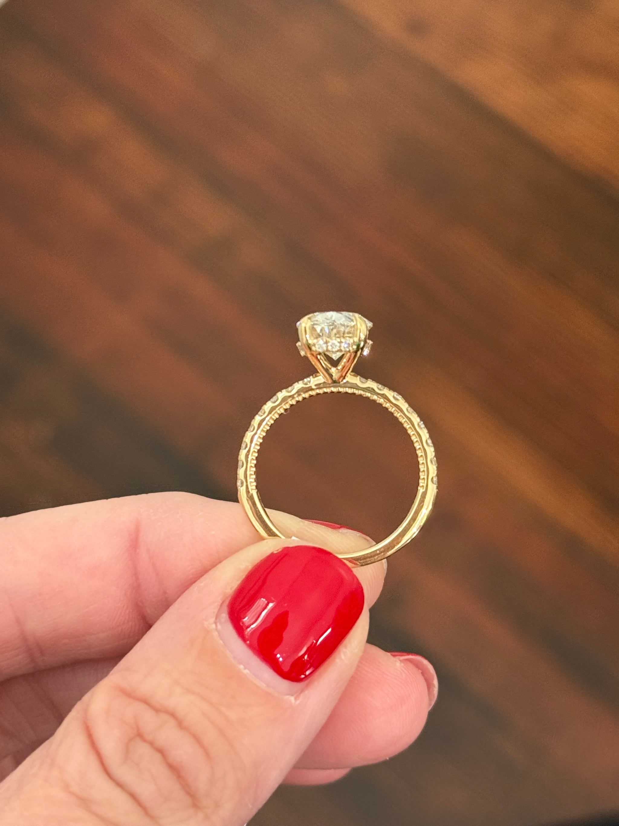 Yellow gold oval lab diamond ring. Center stone is IGI certified and 3.02cts E VVS2