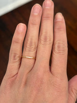 Yellow gold tapered baguette natural diamond band