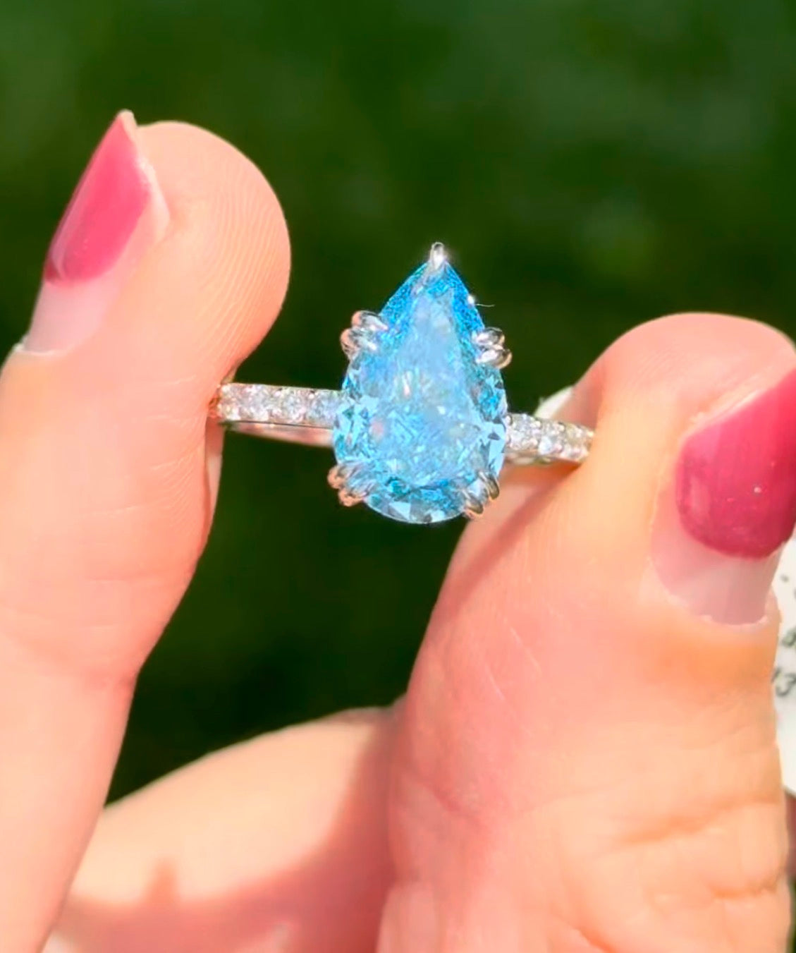 White gold pear shape blue lab diamond and white lab diamond ring