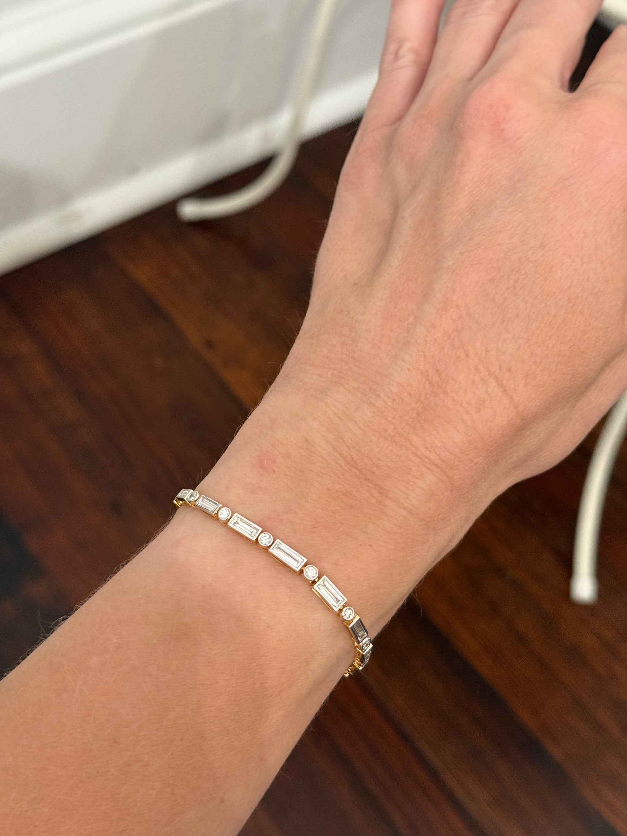 Yellow gold with white gold bezel setting 3.84ct baguette and round natural diamond bracelet