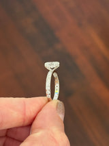 White gold oval and round lab diamond ring. Center stone is 1ct and 8.5x6mm
