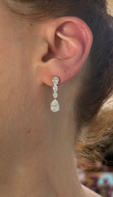 Yellow gold pear shape and oval lab diamond earrings. Prongs are white gold.