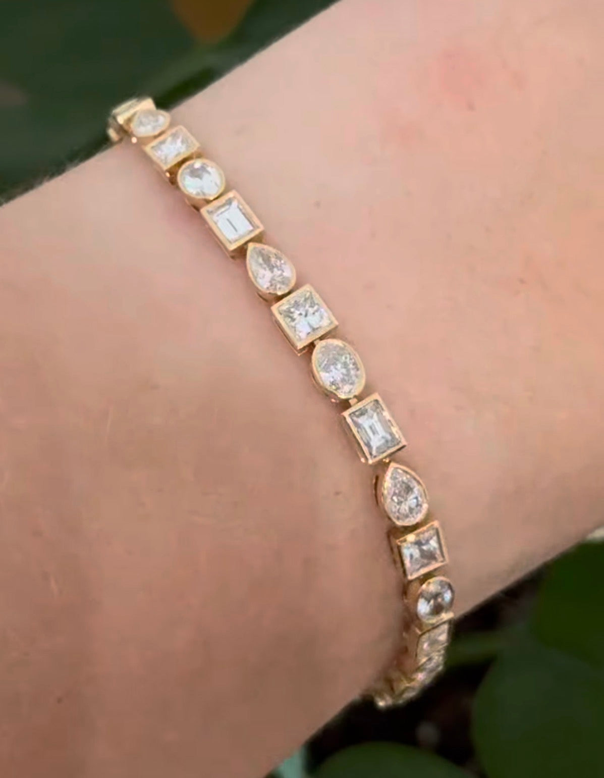 Yellow gold bezel set 6.68ct pear shape, oval, princess and emerald cut natural diamond bracelet